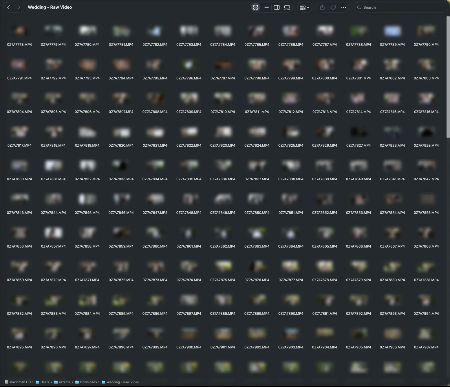Finder showing 422 raw wedding clips as a grid of identical thumbnails named after a camera counter